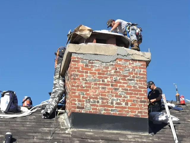 Torrington Chimney Sweep installing a custom chimney crown in Torrington, CT
