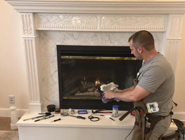 Torrington Chimney Sweep performing fireplace maintenance in Torrington, CT