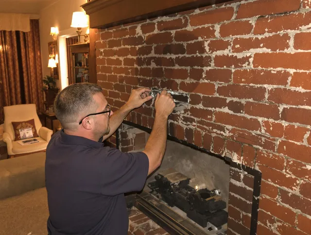 Torrington Chimney Sweep expert fixing a fireplace in Torrington, CT